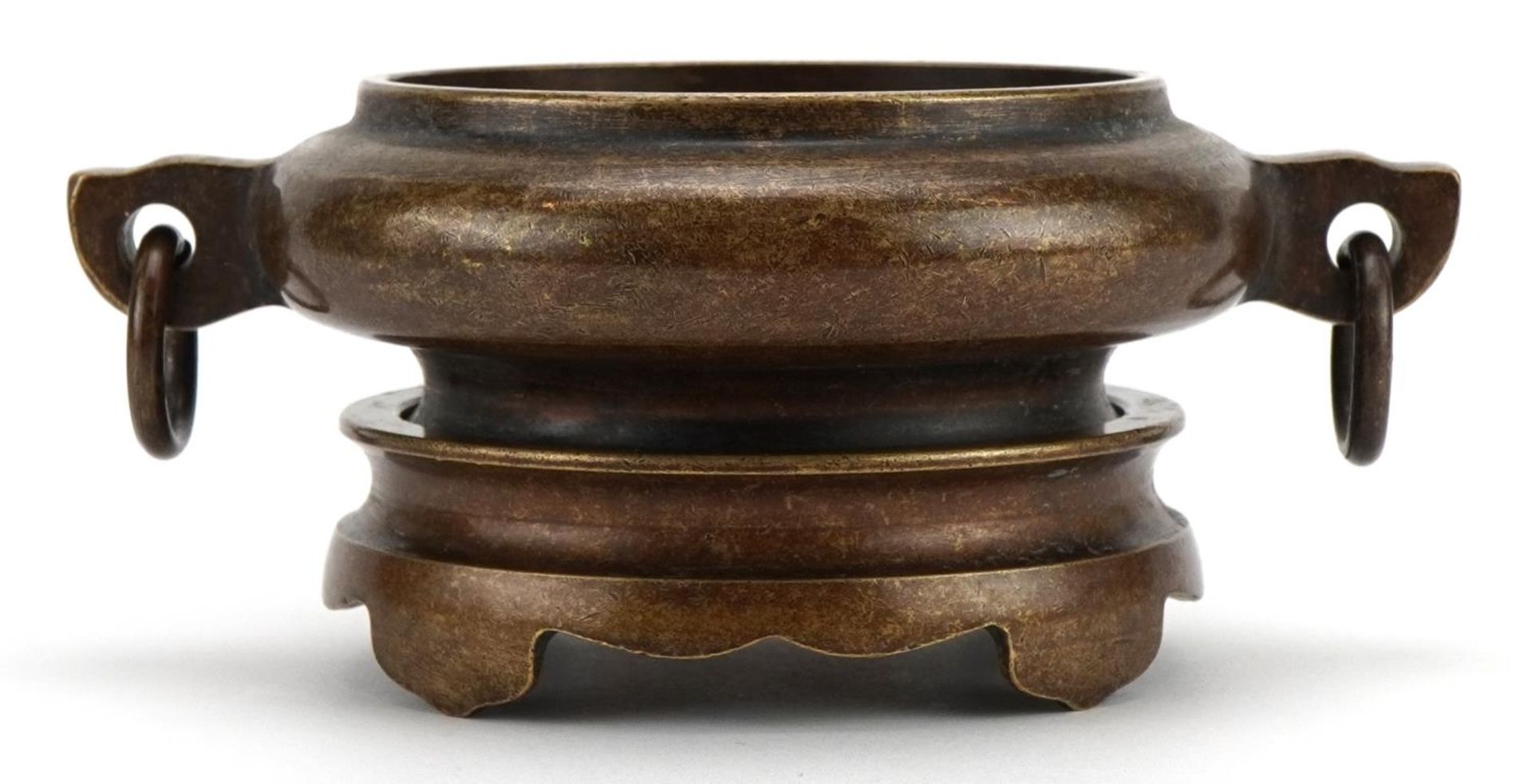 Chinese patinated bronze twin handled censer on stand, four figure character marks to the base, 15cm