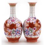 Pair of Chinese porcelain vases hand painted in the famille rose palette and iron red with dragons
