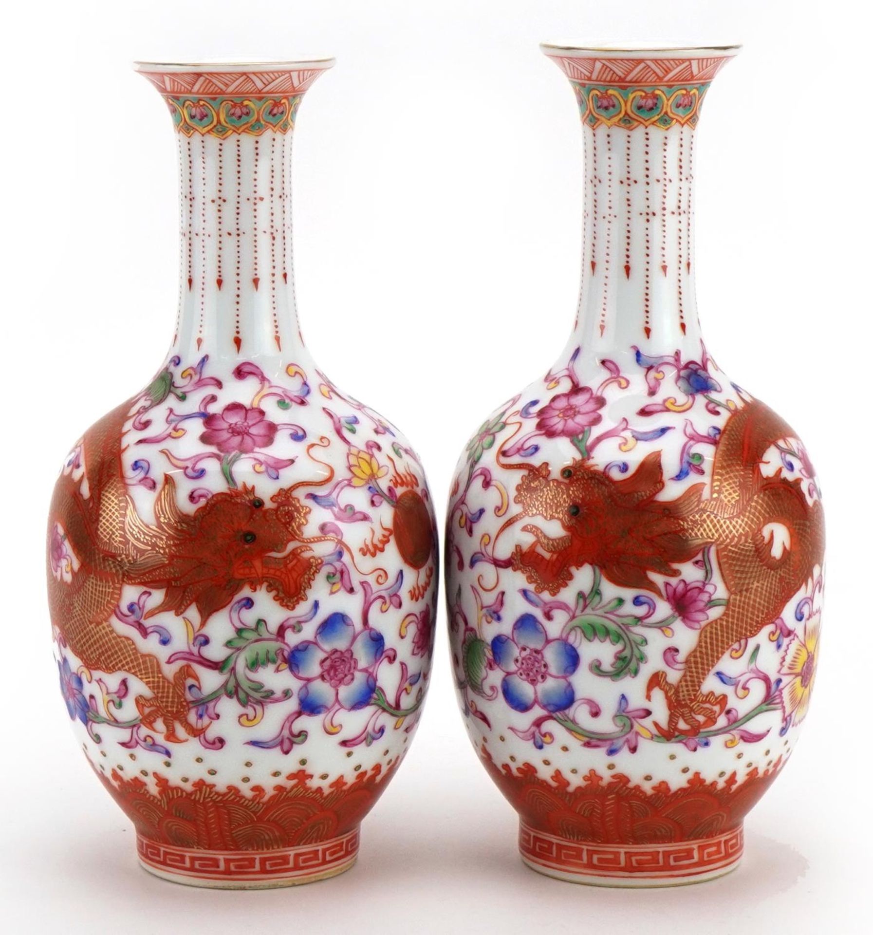 Pair of Chinese porcelain vases hand painted in the famille rose palette and iron red with dragons