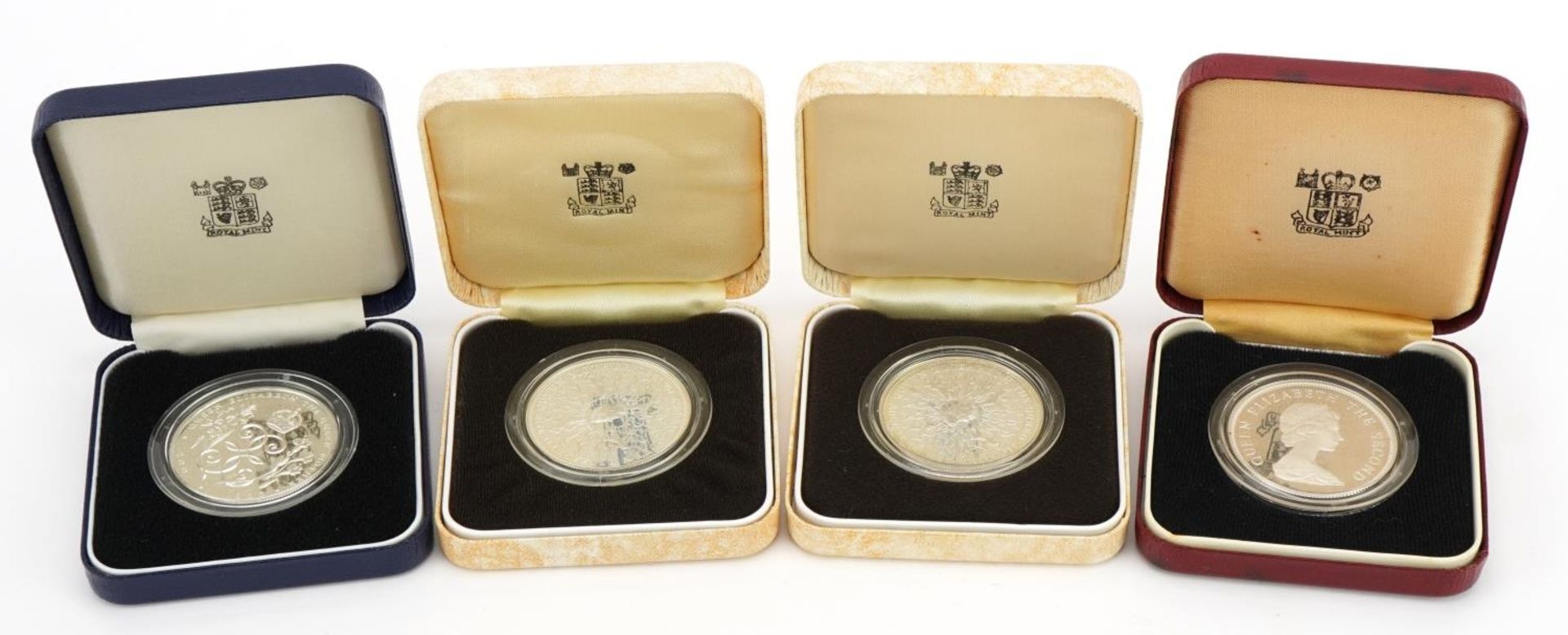 Four silver proof coins with fitted cases including Her Majesty Queen Elizabeth The Queen Mother