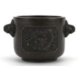 Chinese patinated bronze censer with twin handles cast with panels of dragons chasing a flaming