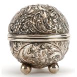 William Comyns, Victorian silver string box embossed with birds amongst foliage raised on three ball