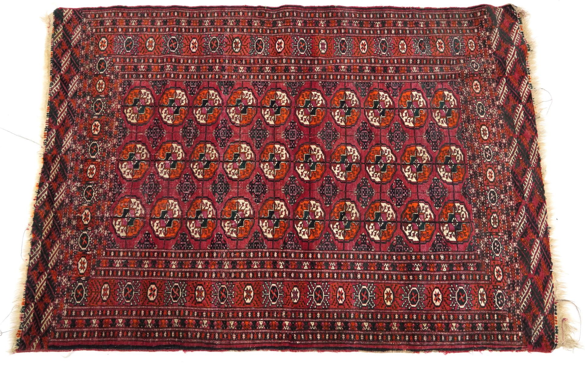 Rectangular red and blue ground Bokara rug with all over geometric design, 180cm x 130cm