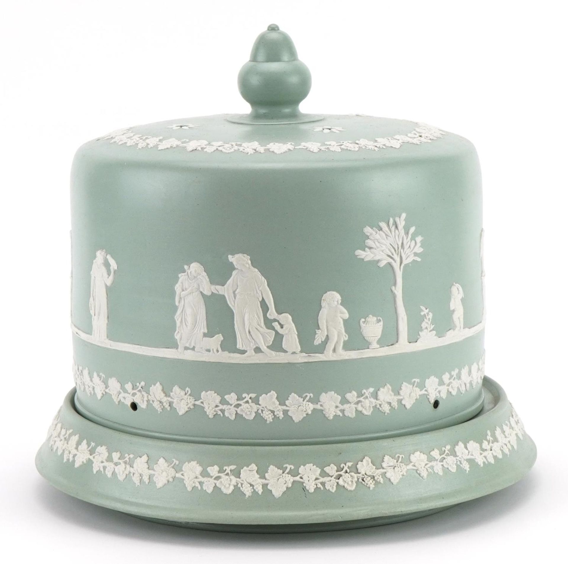 Victorian Jasperware cheese dome on stand decorated with classical figures, the base 27cm in