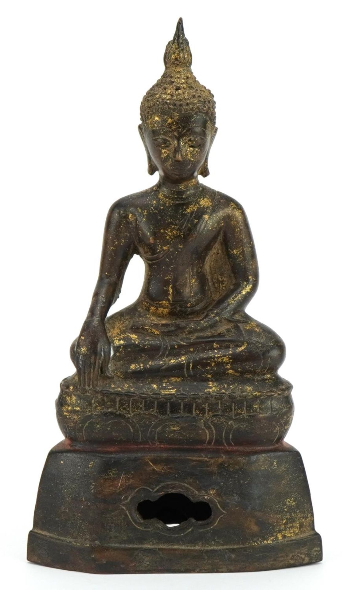 South East Asian partially gilt patinated bronze figure of seated Buddha, 22cm high