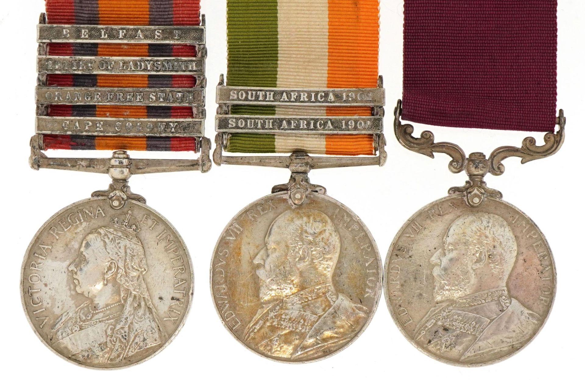 British military three medal group comprising Queen's South Africa Medal with Belfast, Relief of