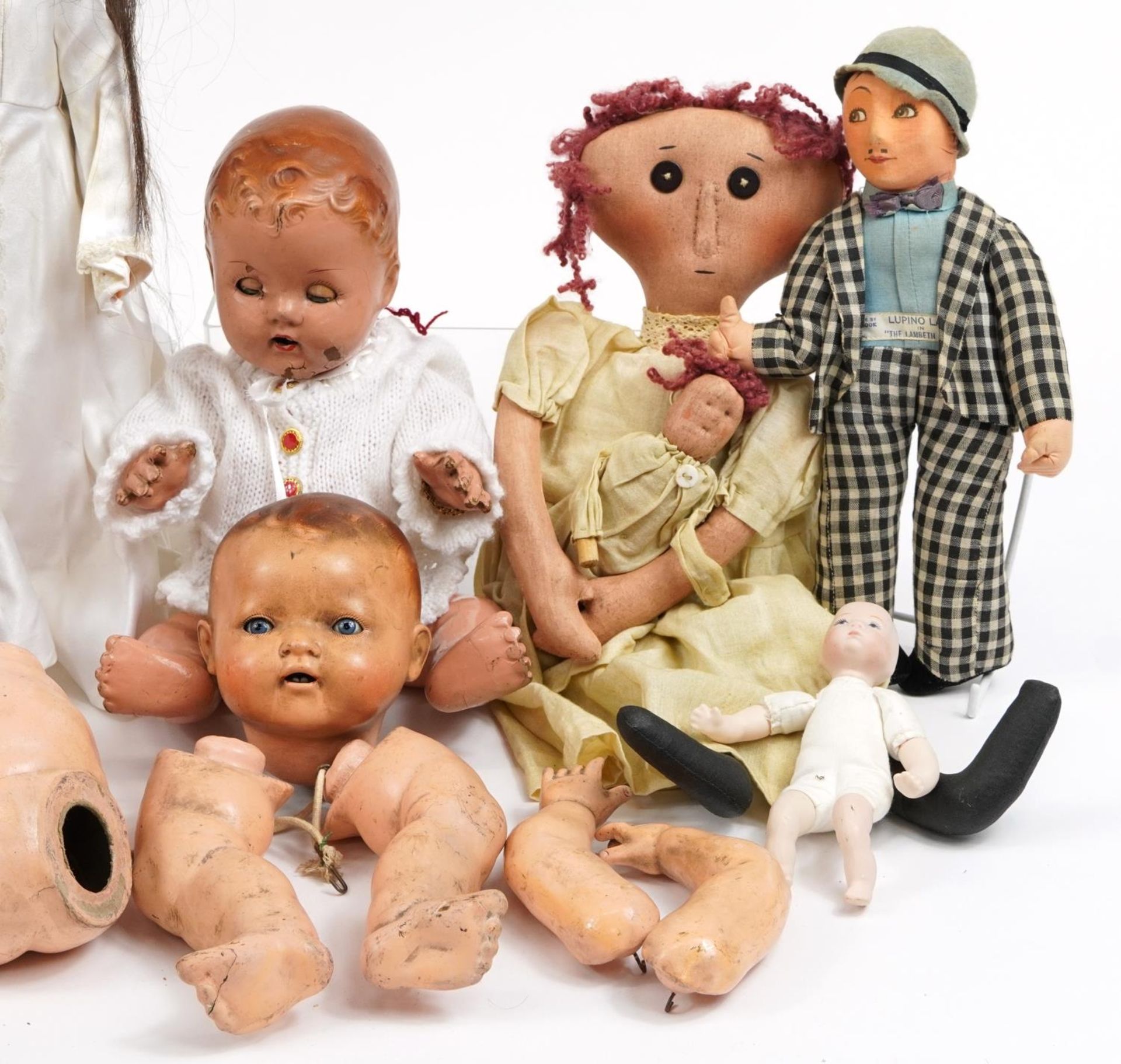 Eight vintage composite and cloth dolls with jointed limbs and two miniature bisque baby dolls, - Image 3 of 4