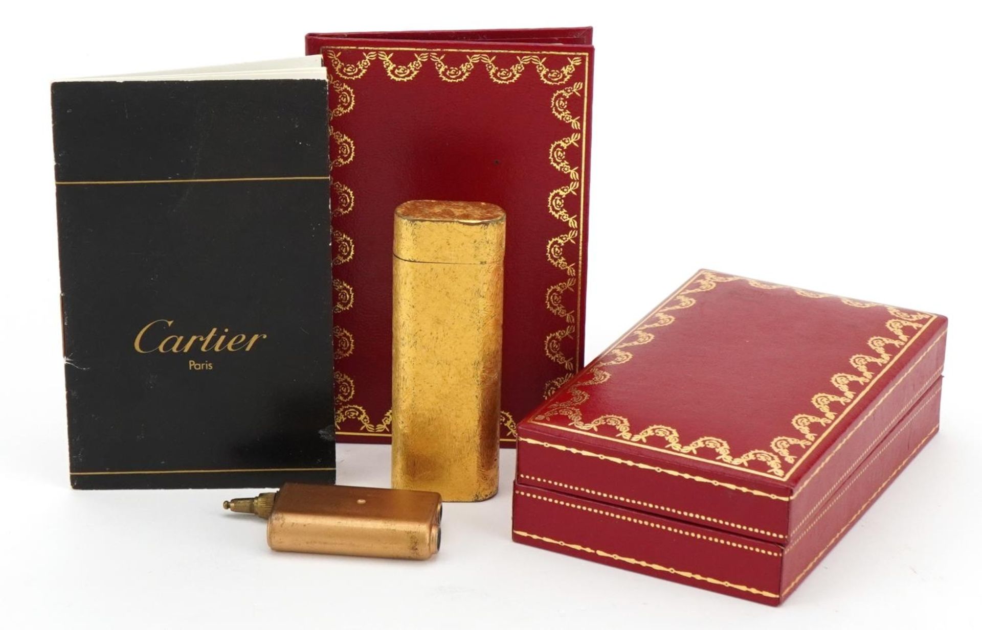 Cartier gold plated pocket lighter with fitted box, guarantee card and wallet