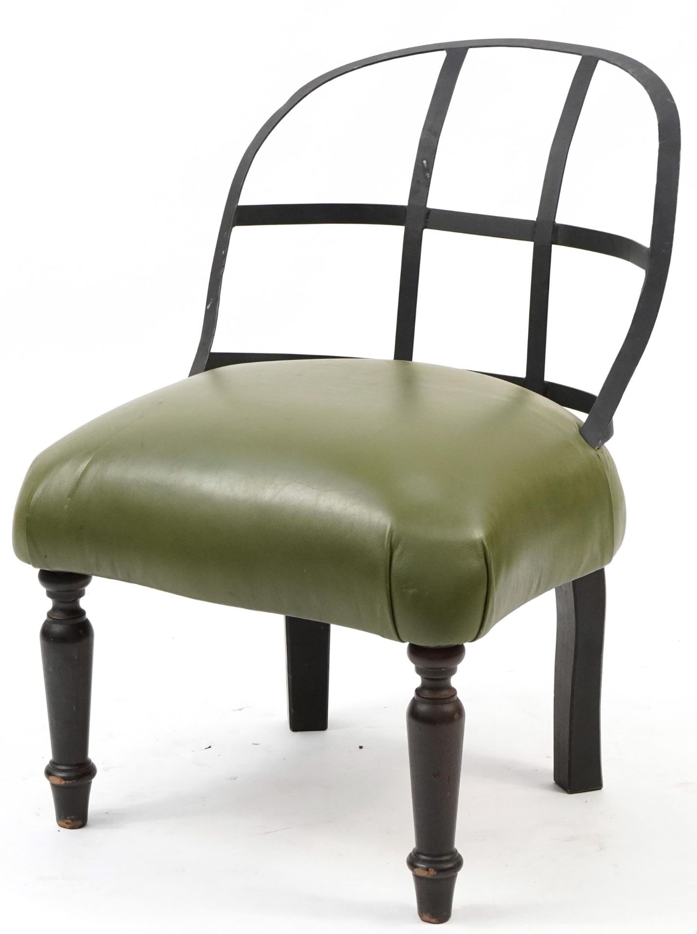 Industrial style wrought iron chair with green leather upholstered seat on turned mahogany legs,