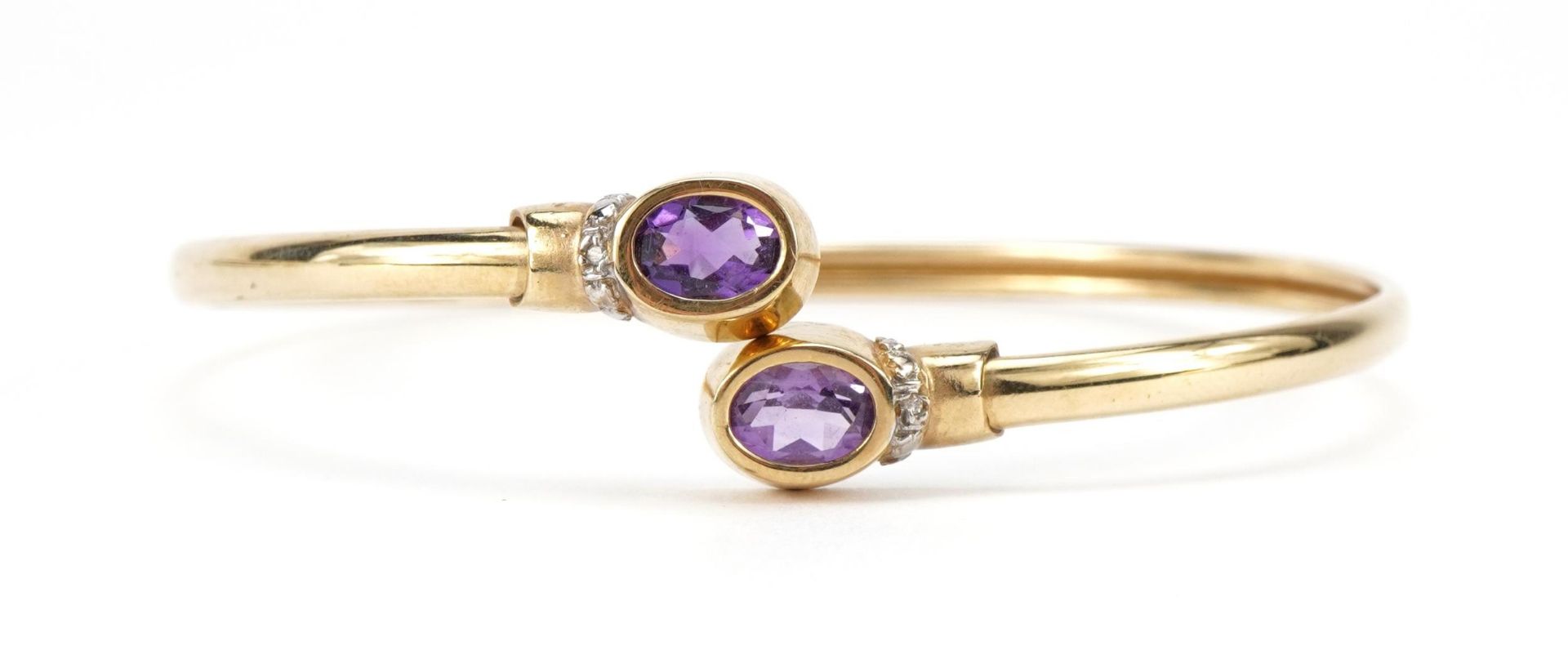 Amethyst and diamond crossover bangle, 7.0cm wide, 6.9g