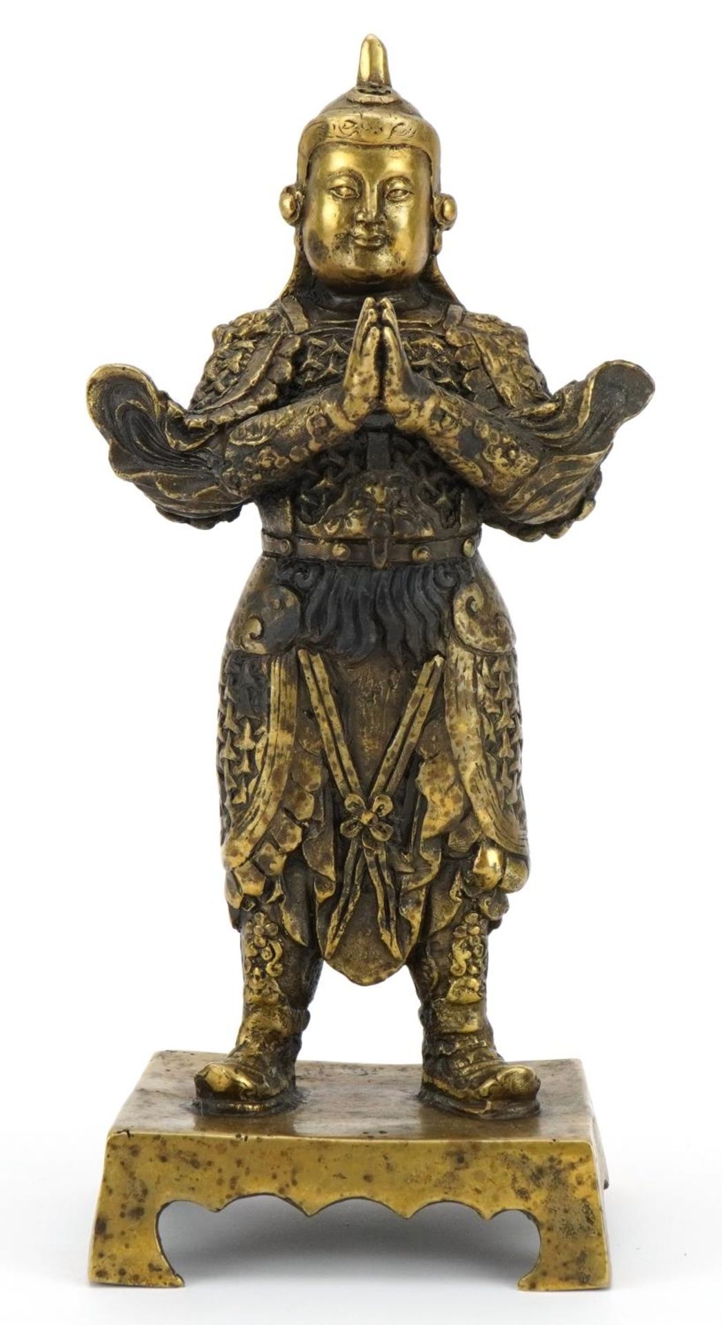 Chino Tibetan patinated bronze figure of a warrior, impressed character marks to the reverse, 23.5cm