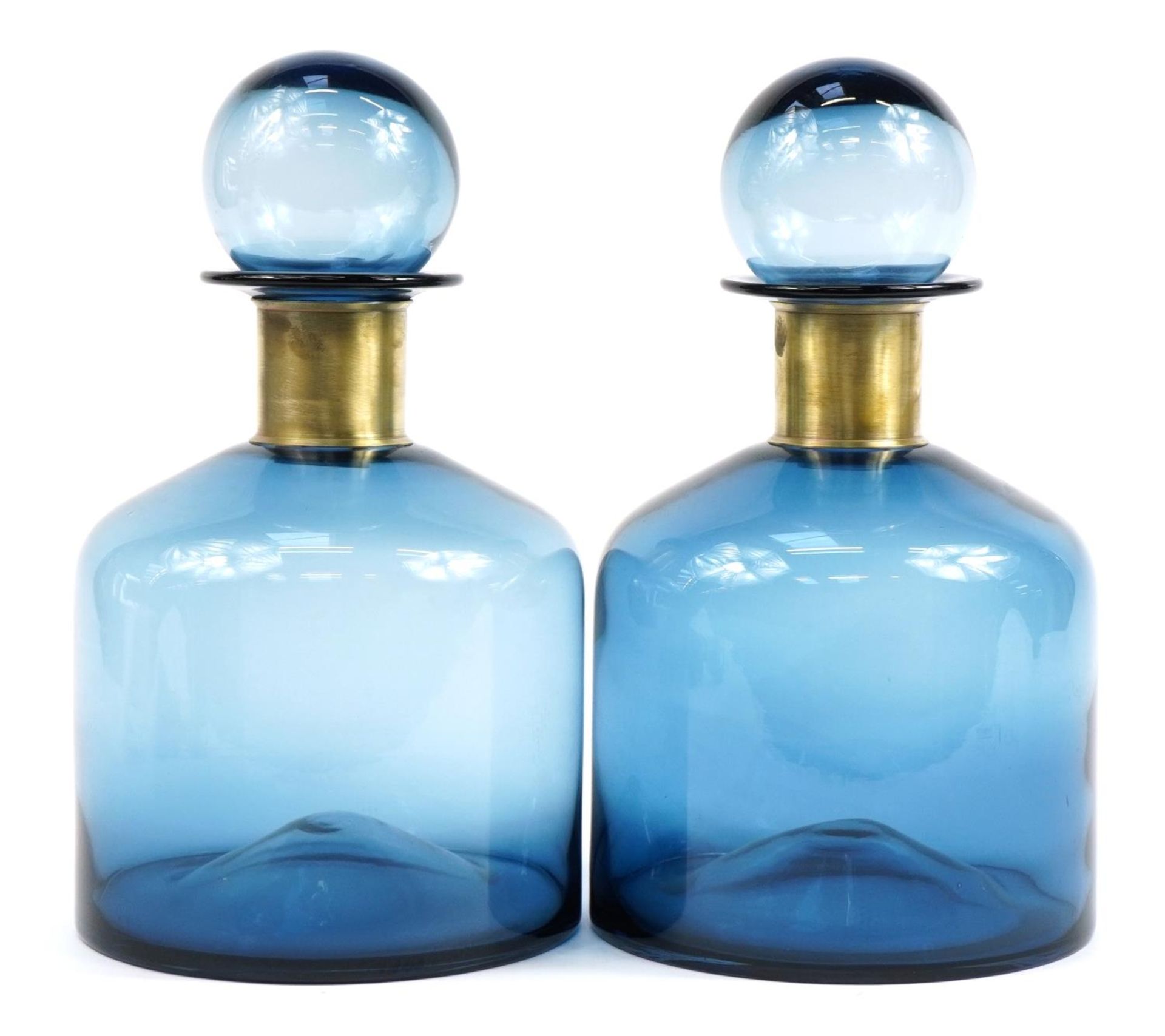 Pair of Danish style oversized blue glass display scent bottles with stoppers, each 37cm high