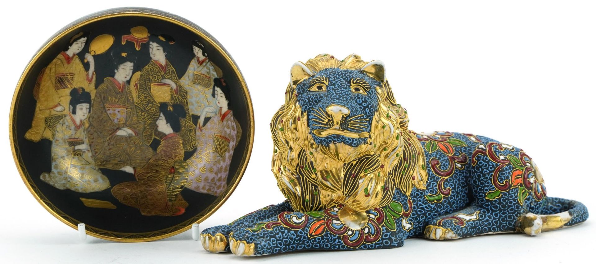 Japanese Satsuma pottery bowl hand painted with figures and a recumbent lion, the largest 21cm in