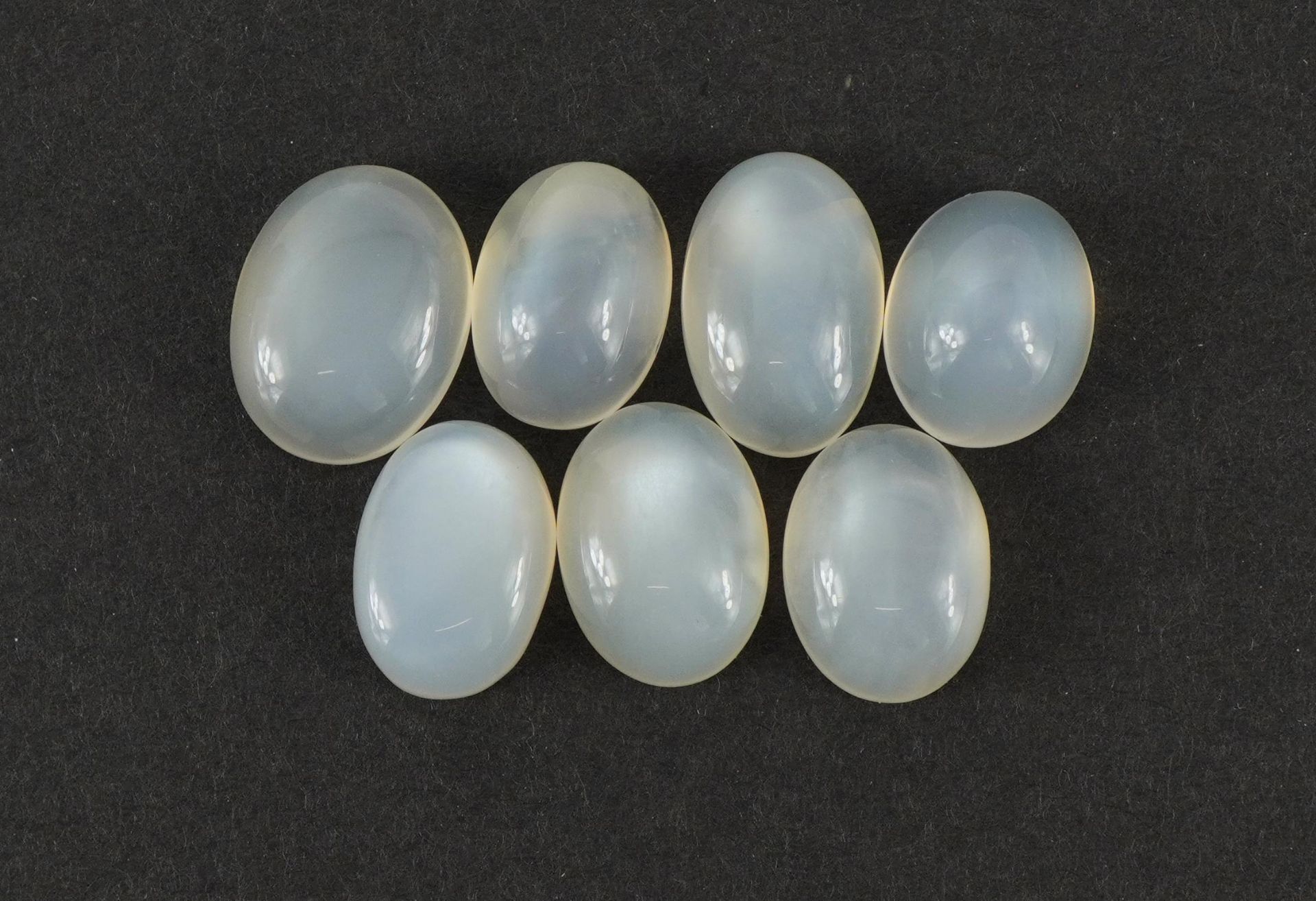 Seven oval moonstone gemstones, total 33.72 carats