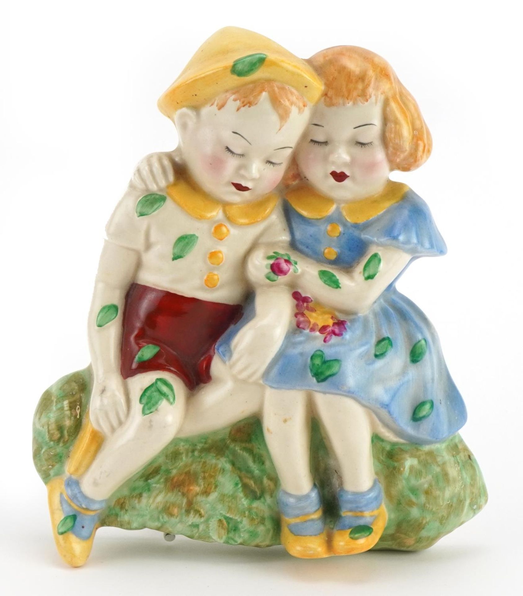 Crown Devon, Art Deco pottery wall plaque of two children, 16cm high