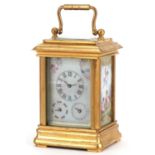 Miniature brass cased carriage clock with swing handle and Sevres style panels, hand painted with