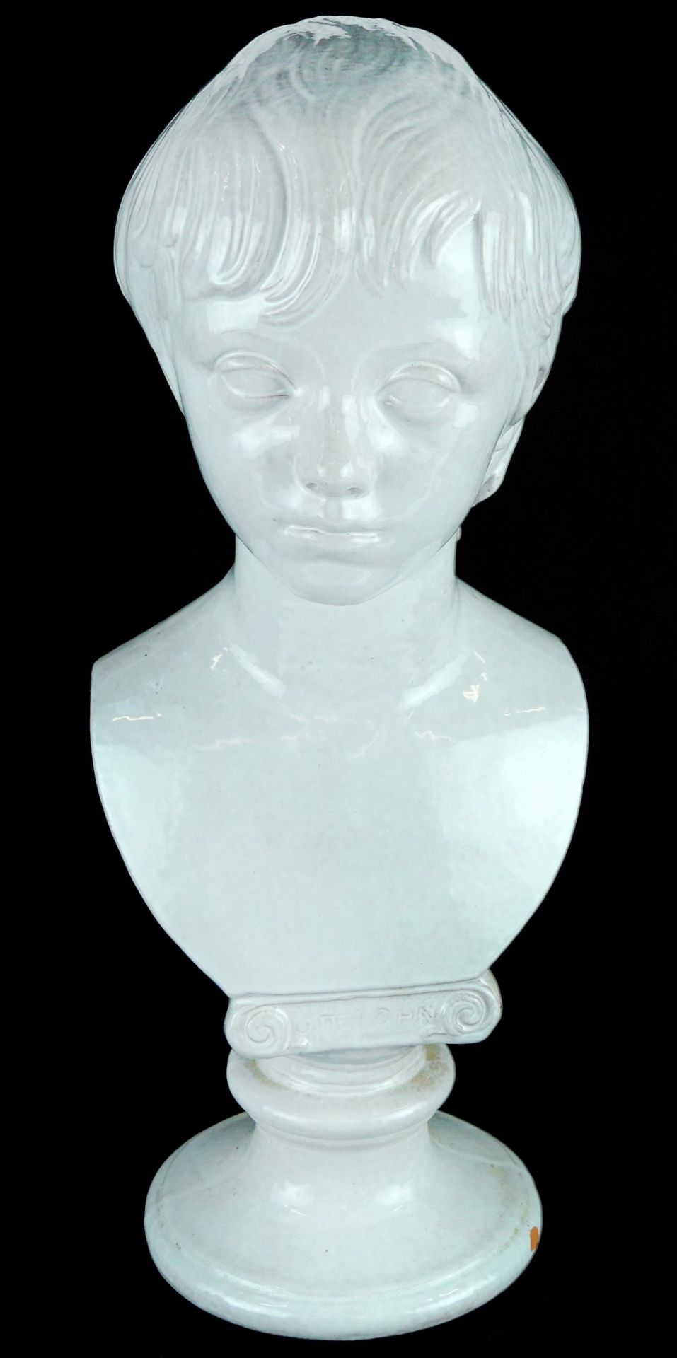 White glazed terracotta classical bust of a young child, 48cm high