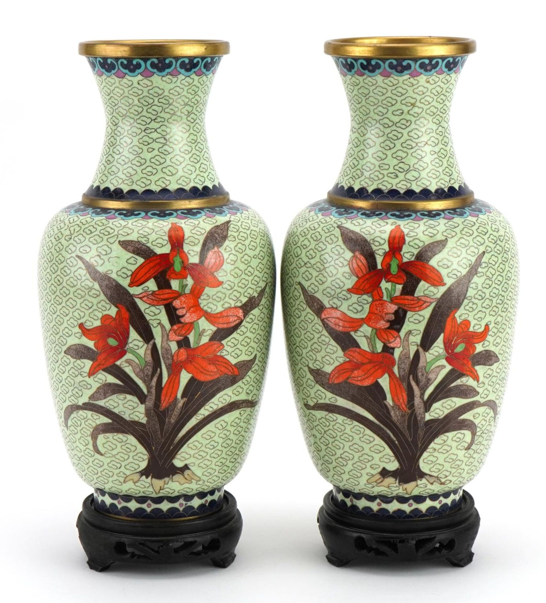 Pair of Chinese cloisonne vases raised on hardwood stands, each enamelled with flowers, each 29cm