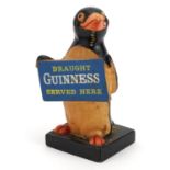 Vintage Guinness Ruberoid advertising figure with Charles E Tresise label to the base, 17.5cm high