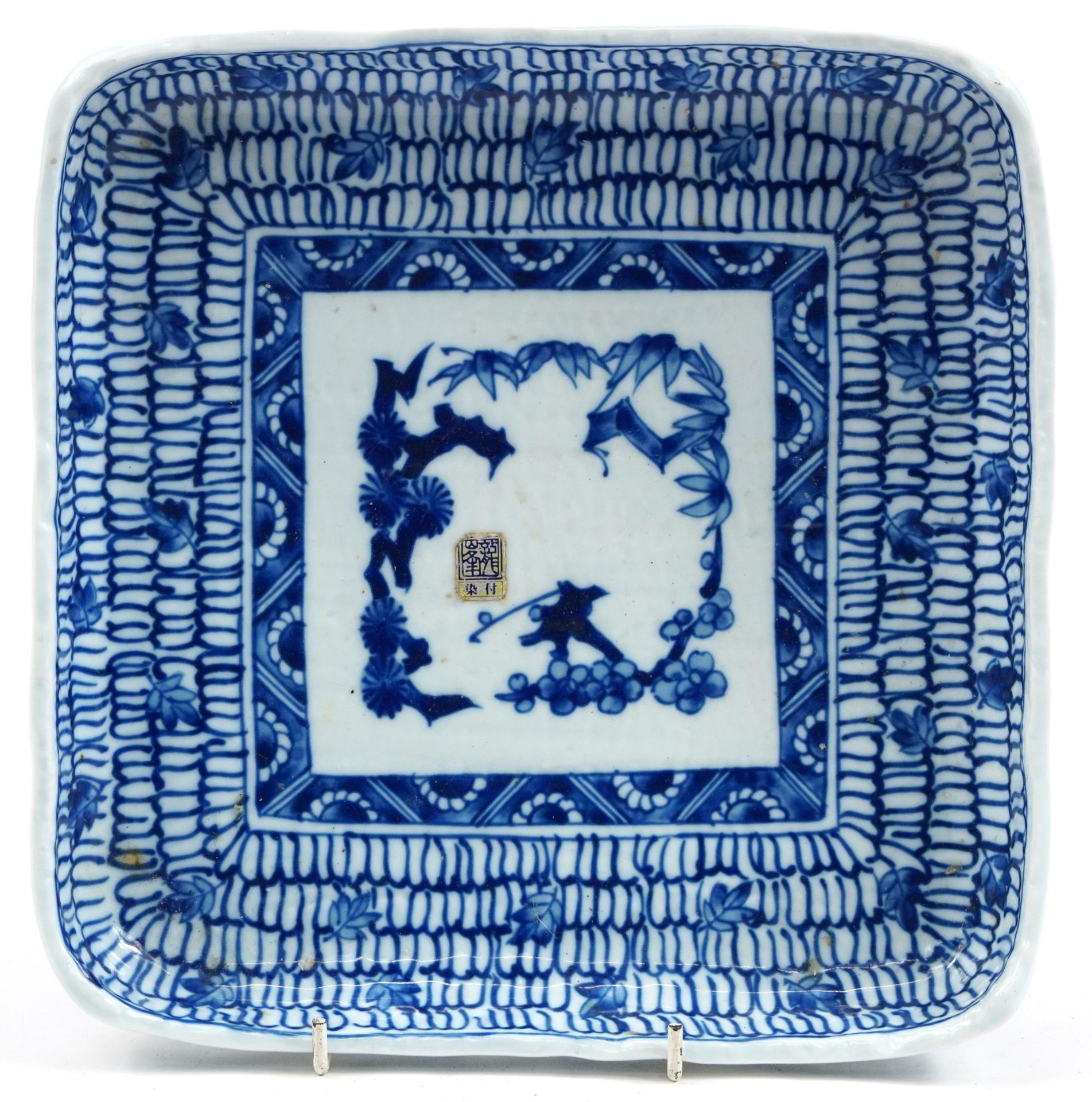 Japanese blue and white porcelain square four footed dish hand painted with flowers, 23.5cm x 23.5cm