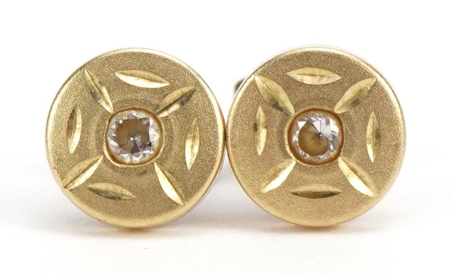 Pair of yellow metal clear stone stud earrings, 6.4mm in diameter, 0.5g