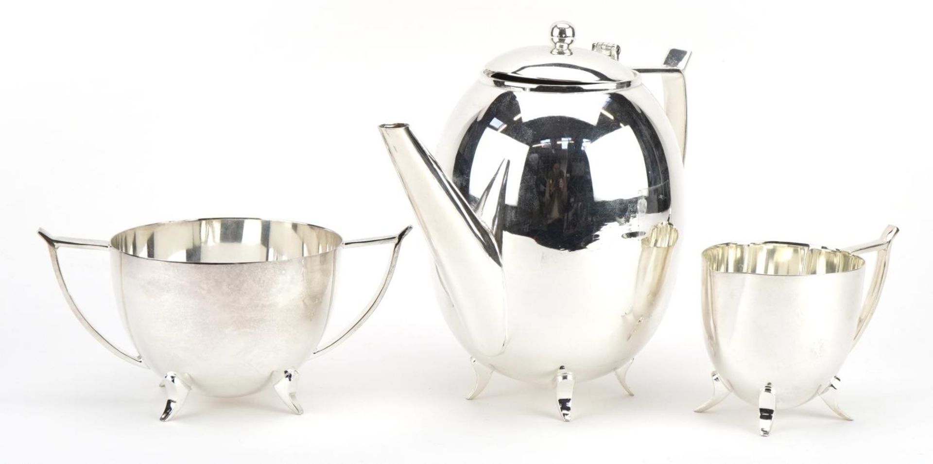 Art Deco style silver plated three piece tea set, the teapot 21cm wide