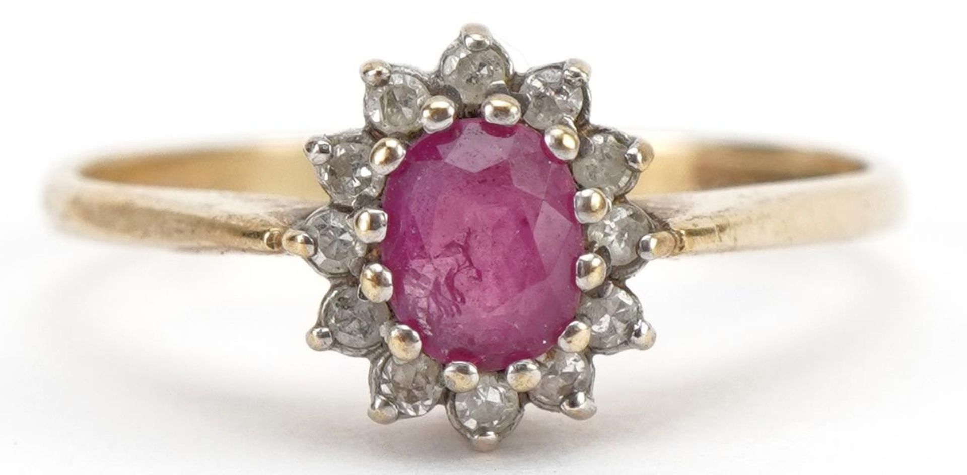 9ct gold ruby and diamond flower head ring, the ruby approximately 4.6mm x 3.6mm, size N, 1.4g