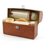 Vintage Coracle picnic set housed in a tan leather case, retailed by Finnigans, Bond Street, London,