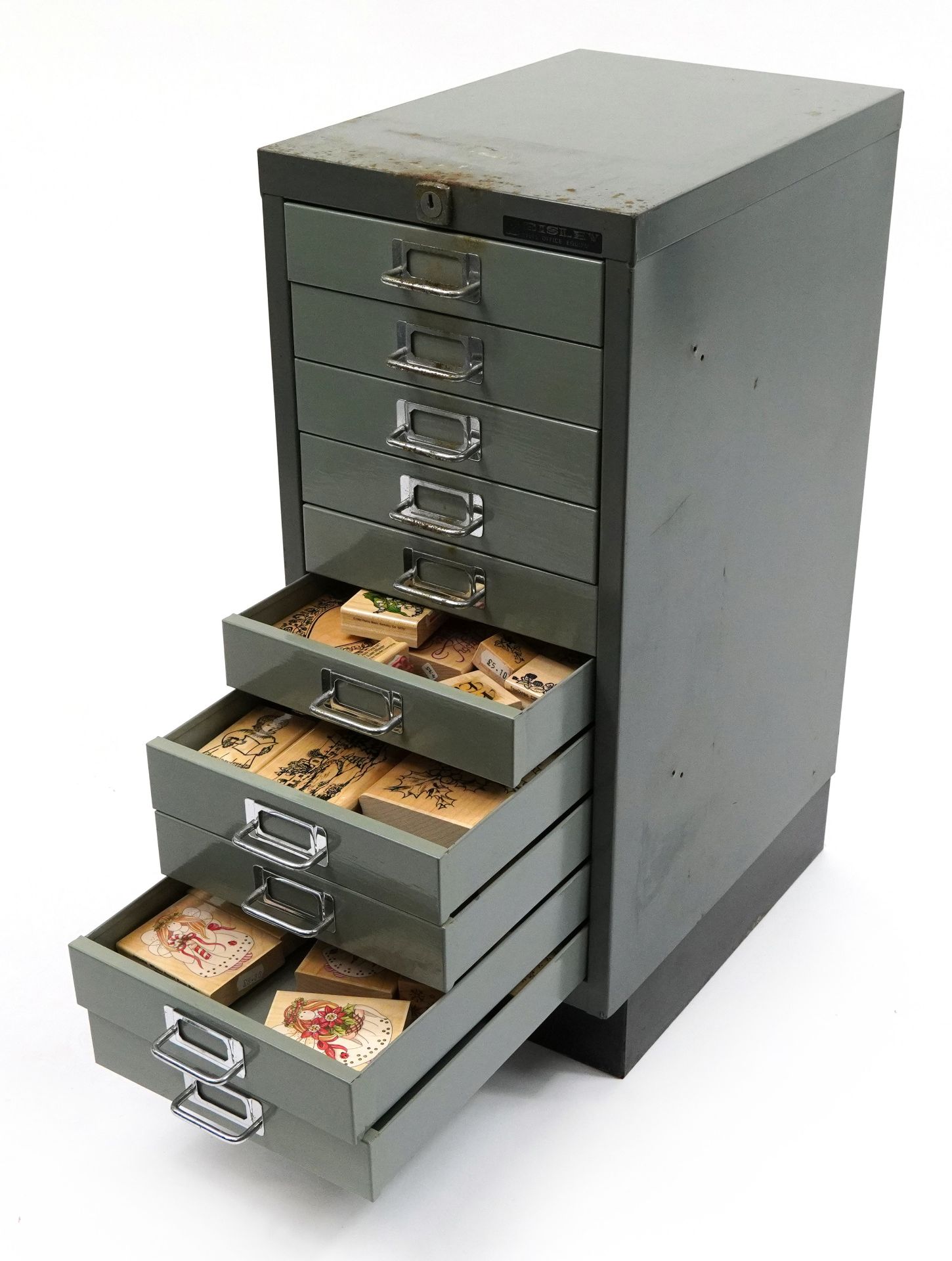 Large collection of wooden printing blocks and ink stamps housed in a Bisley ten drawer filing