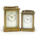 Two brass cased carriage clocks with enamelled dials and Roman numerals, the largest 11cm high