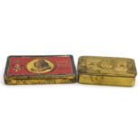 Two military interest tins comprising World War I brass Mary and Boer War, the largest 15.5cm wide