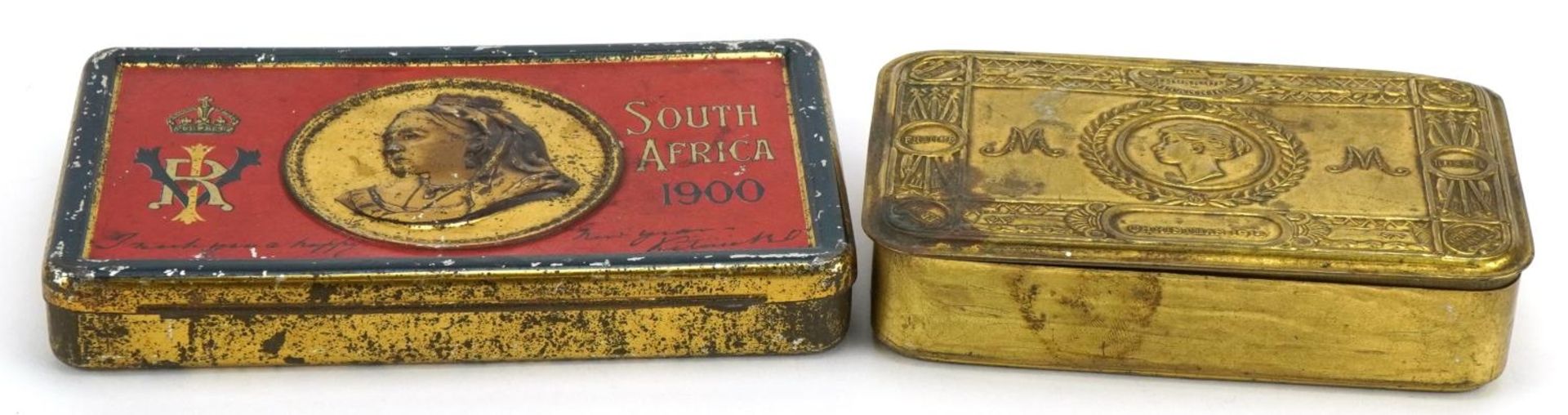 Two military interest tins comprising World War I brass Mary and Boer War, the largest 15.5cm wide