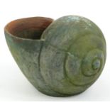 Large terracotta planter in the form of a snail shell, 27cm H x 36cm in length