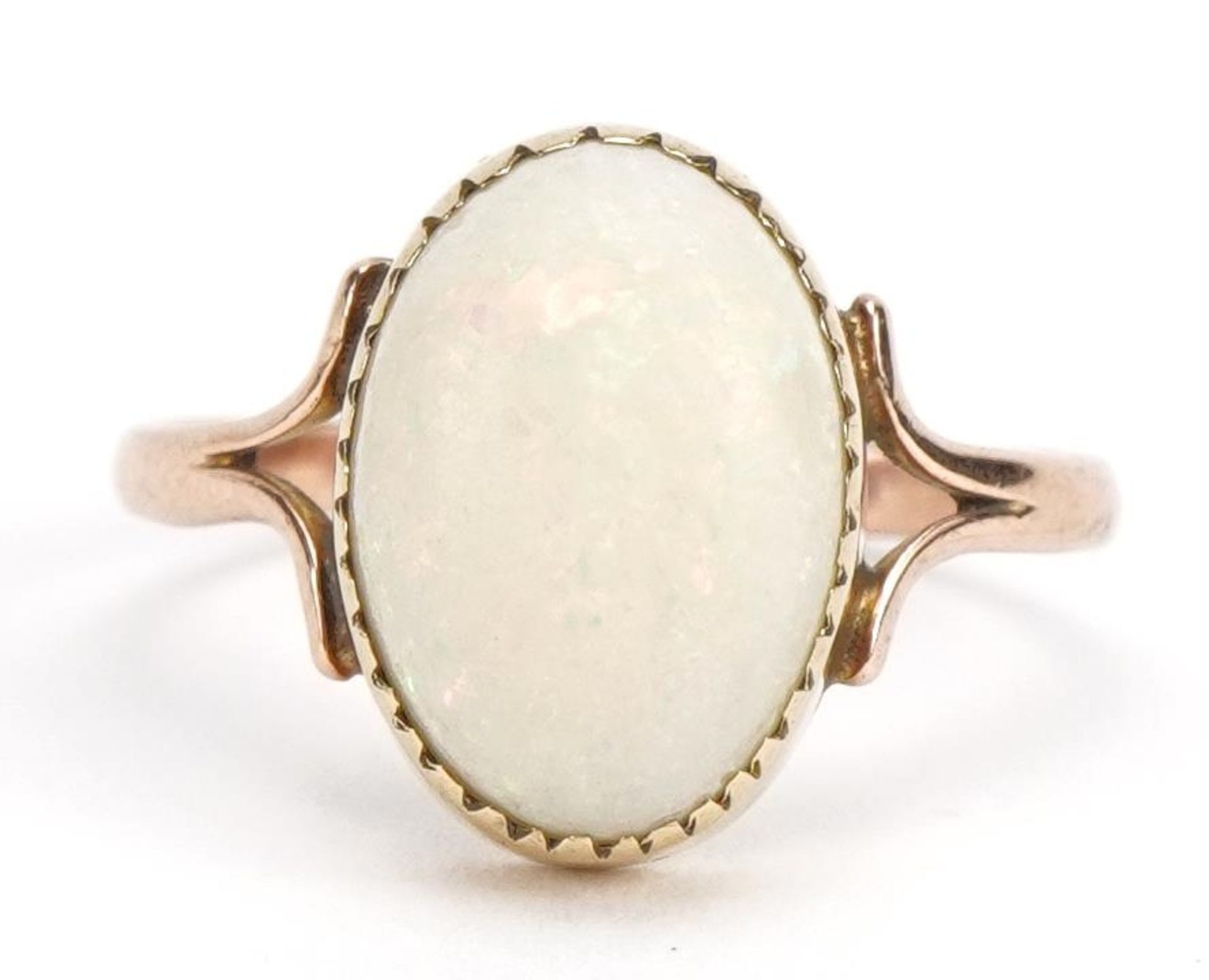 Unmarked 9ct rose gold cabochon opal ring, the opal approximately 12.6mm x 8.9mm, size N, 2.1g