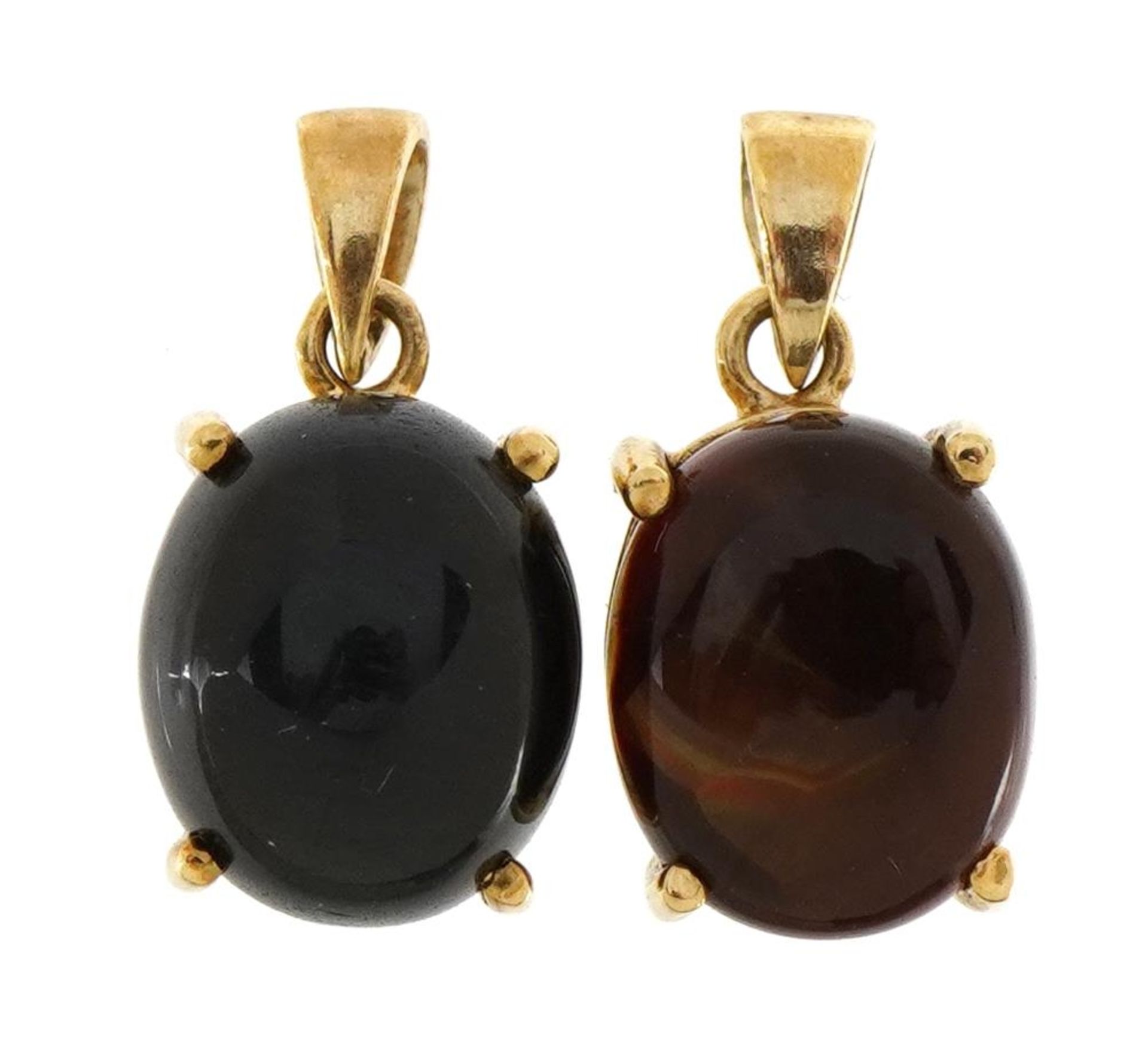 Two 9ct gold pendants, one set with a cabochon blue stone, the largest 1.7cm high, total 3.9g