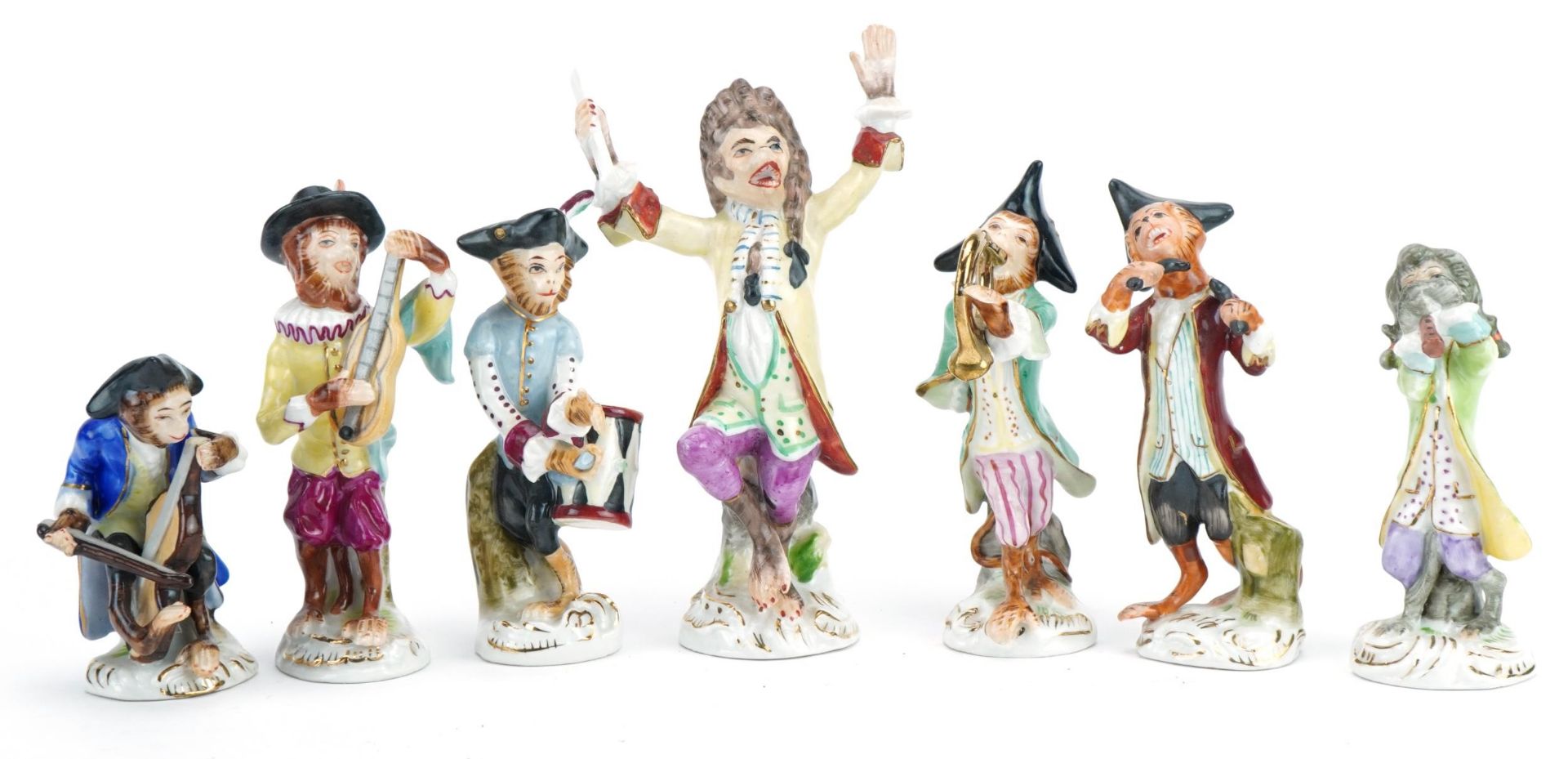 Set of eight continental hand painted porcelain monkey band musicians, 15.5cm high