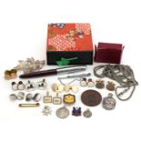 Objects including Parker fountain pen, enamelled badges, silver filigree floral brooch and cufflinks