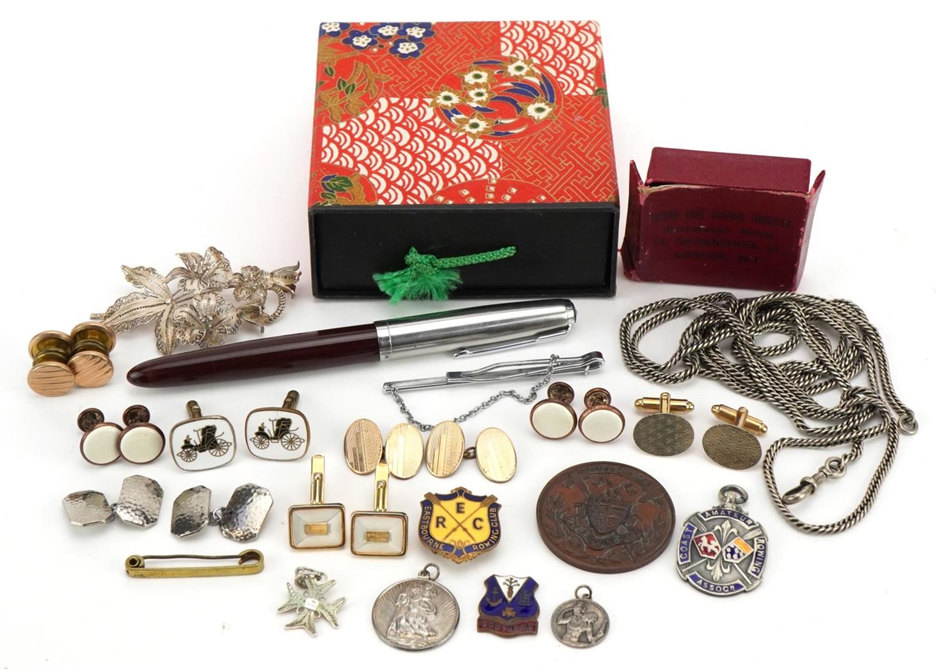 Objects including Parker fountain pen, enamelled badges, silver filigree floral brooch and cufflinks