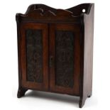 Arts & Crafts oak two door smokers cabinet with fitted interior, 45cm H x 32.5cm W x 18cm D