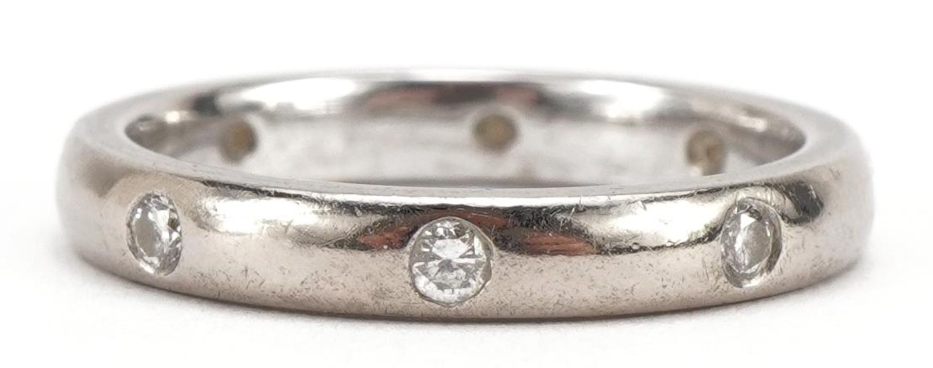 Platinum or 18ct white gold ring set with diamonds, indistinct hallmarks, size M/N, 4.9g