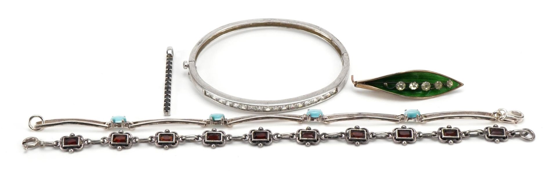 Silver jewellery comprising two gem set bracelets, hinged bangle and pendant set with black stones