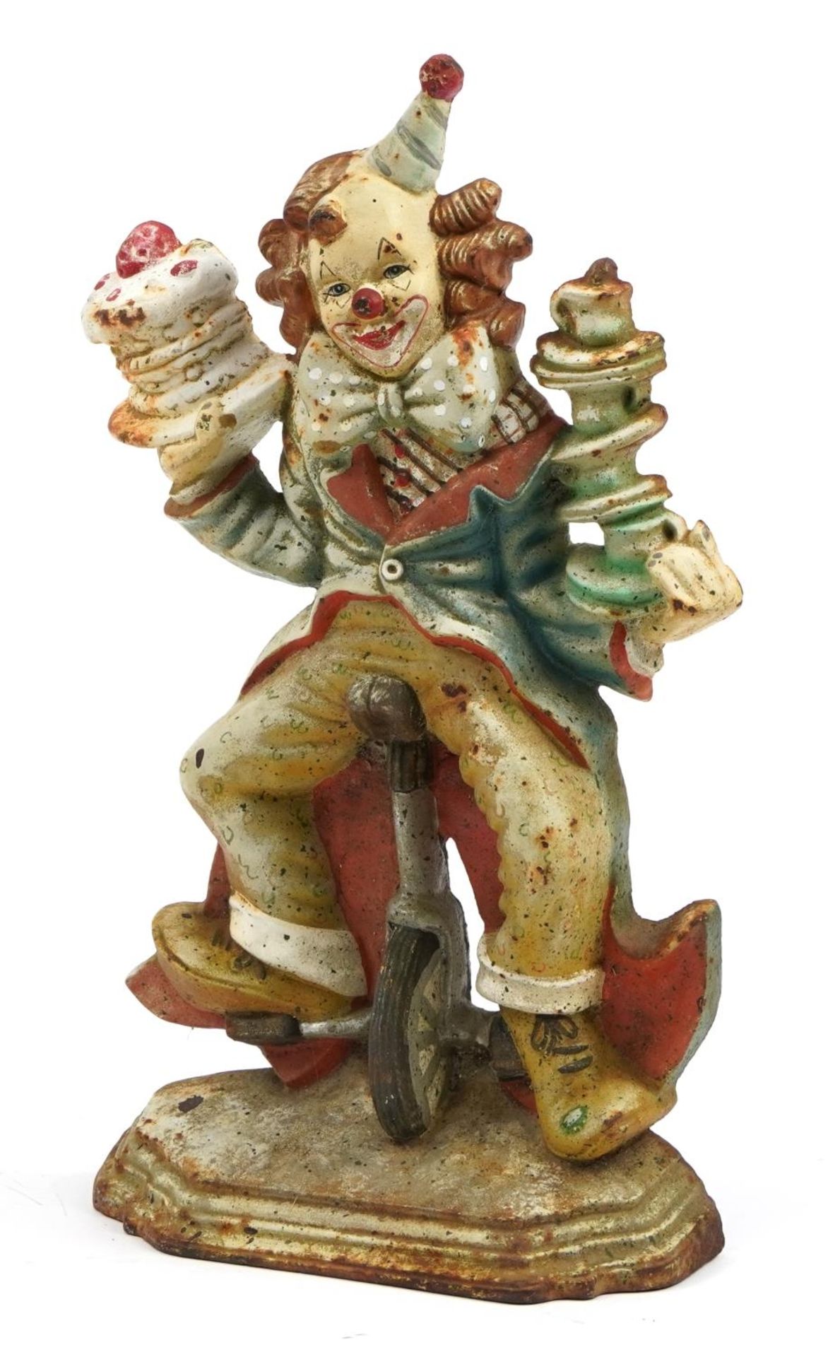 Cast iron doorstop in the form of a clown on a unicycle, 32cm high