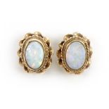 Pair of 9ct gold cabochon opal stud earrings, 1.0cm high, 1.8g