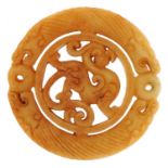 Chinese russet hardstone disk carved with dragons, 7.2cm in diameter, 53.5g