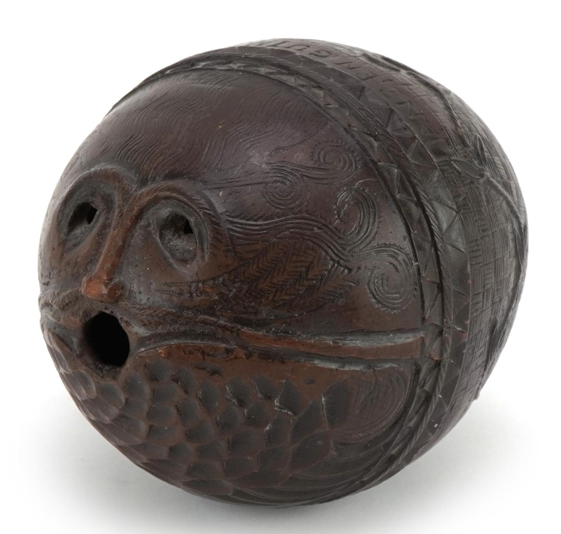 Antique coconut shell carved in the form of a bearded man inscribed Jane En Guin Martin EnGuin, 12.