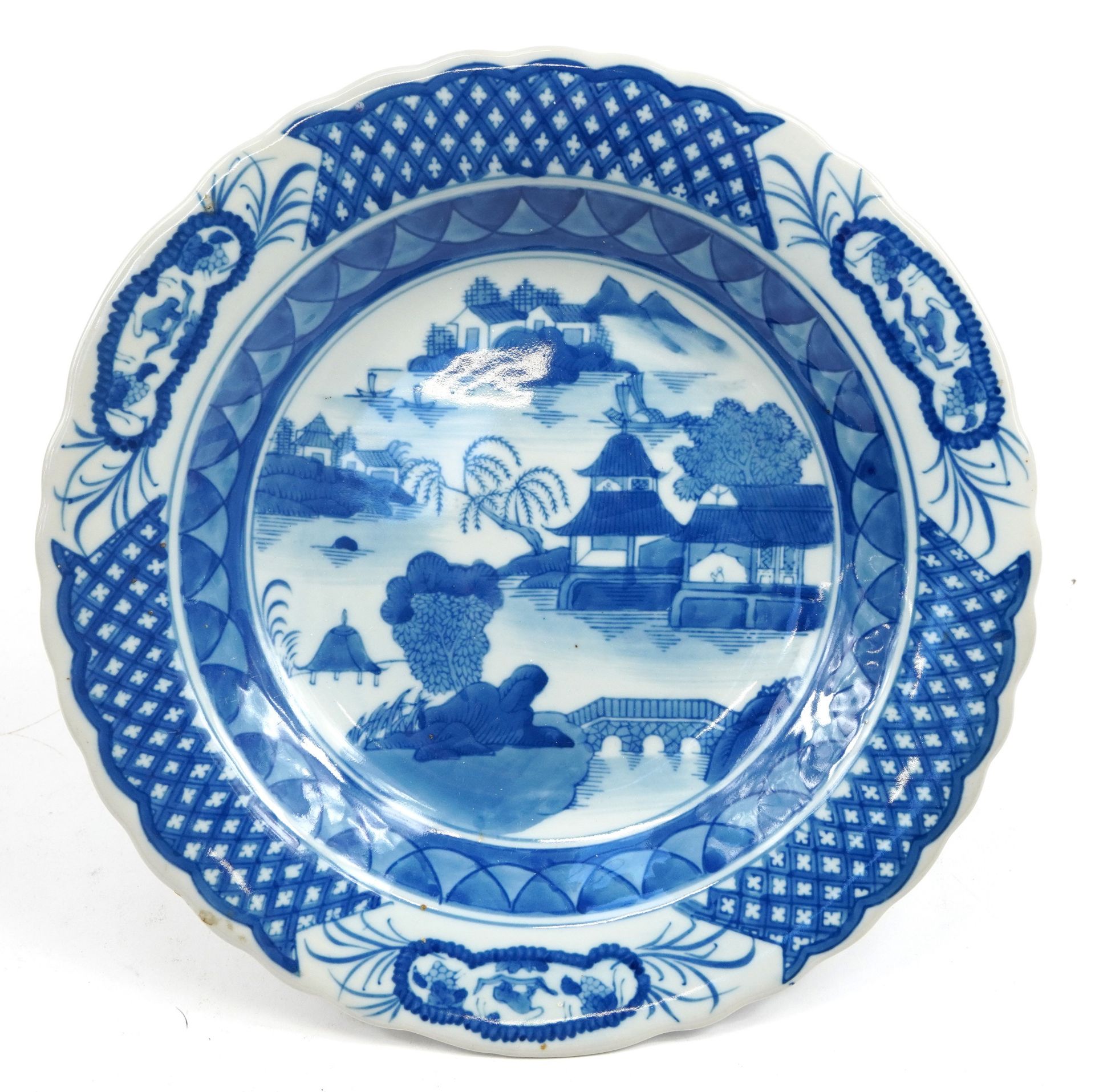 Chinese blue and white porcelain footed centre dish hand painted with a river landscape, character