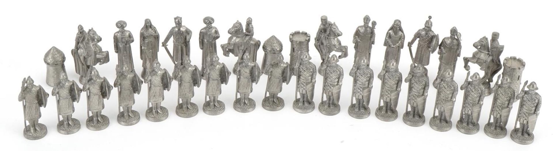 White metal medieval design chess set, the largest pieces 6.5cm high