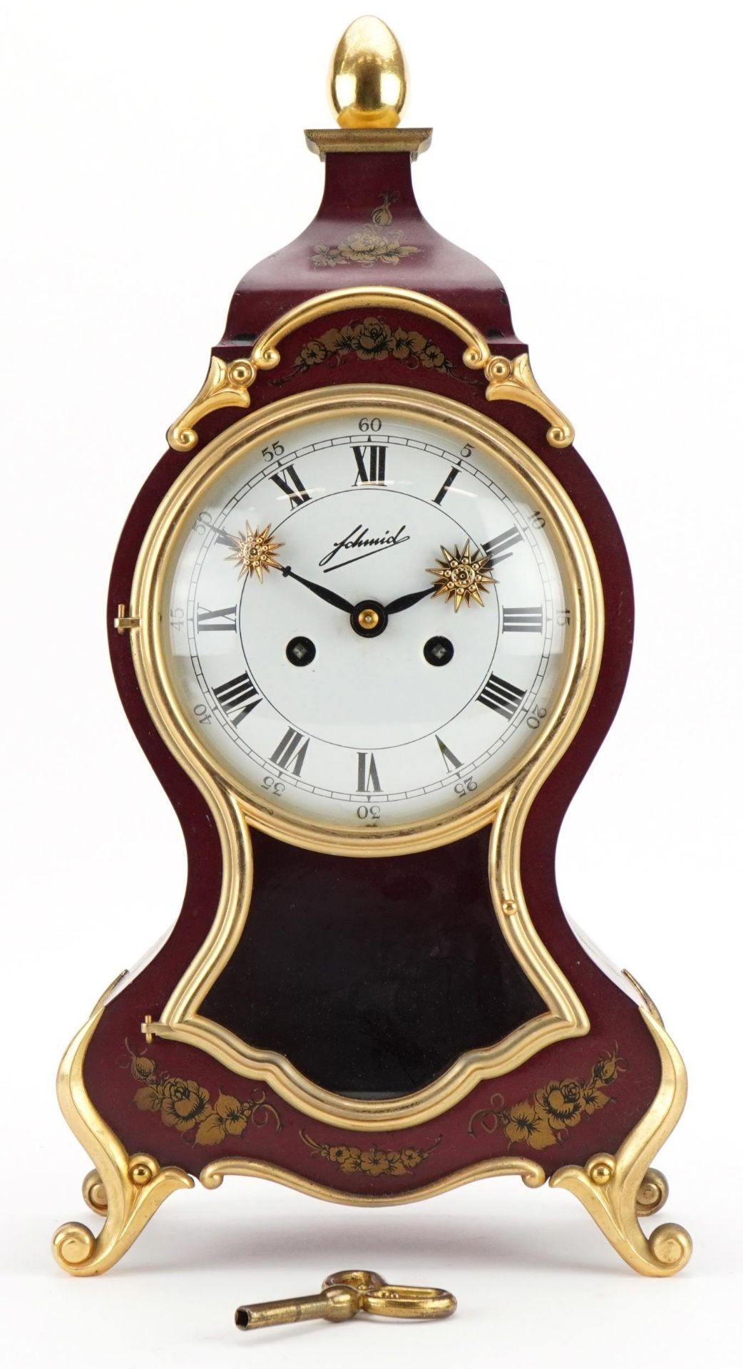 Red lacquer design striking mantle clock, the enamelled dial with Roman numerals, 40cm high