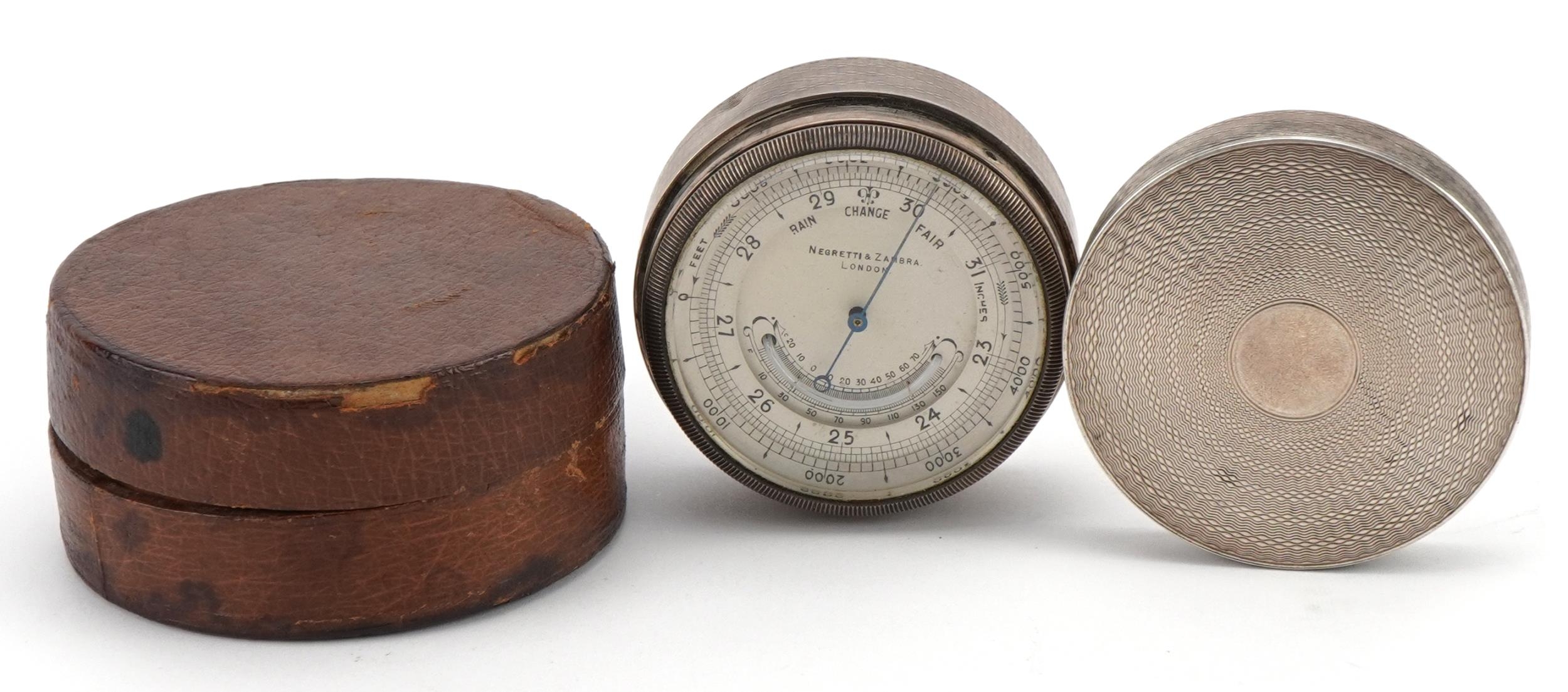 Negretti & Zambra of London, silver cased travelling compensated barometer with silvered dial and