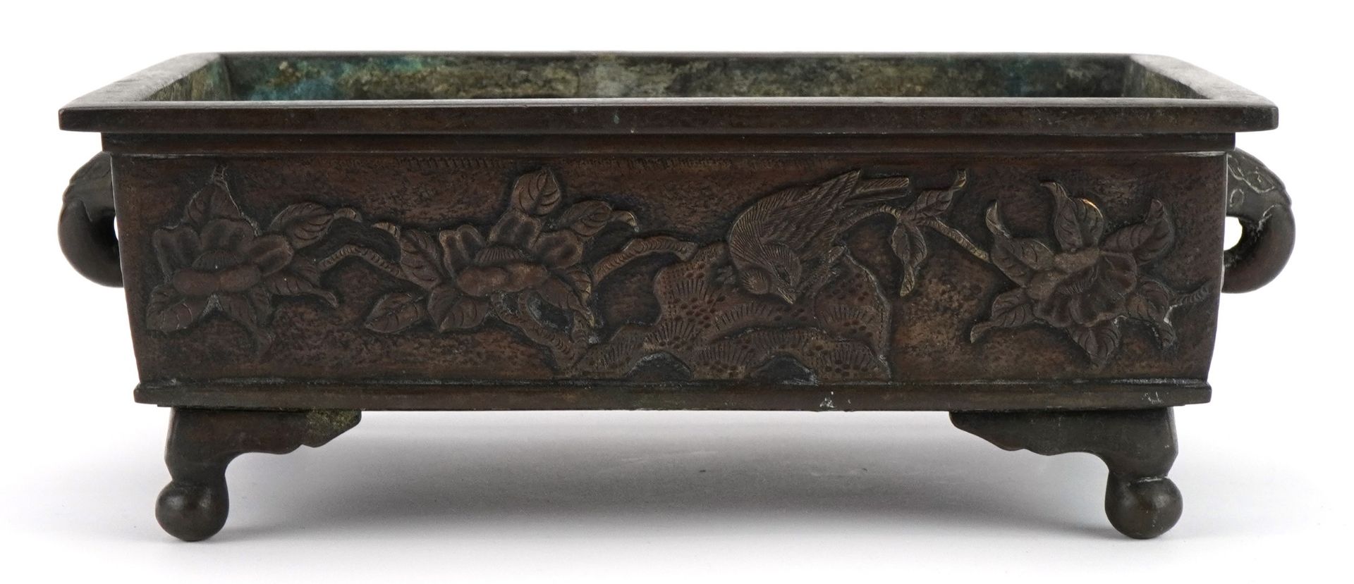 Japanese bronzed four footed planter with elephant head handles, cast with birds amongst flowers,